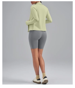 Rear view of slim-fit high-neck yoga jacket and grey high-waist biker shorts set