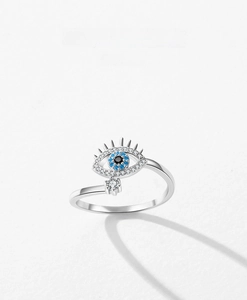 Macro shot of S925 sterling silver evil eye ring featuring blue crystals and white zircons