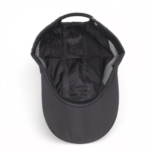 Detail of breathable laser-cut holes and mesh panels on black quick-dry baseball cap