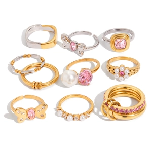 Set of 9 stainless steel rings with pink zircon and pearls in gold and silver finishes