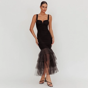 Detail of elegant black bodycon fishtail dress with pleated bust and layered tulle skirt