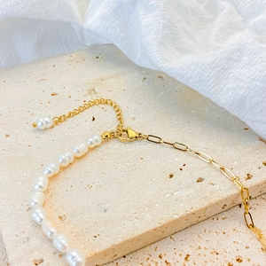 Detail of freshwater pearl necklace with gold oval link chain and lobster clasp closure