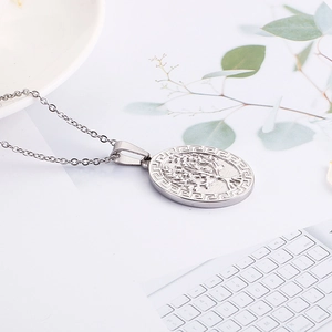 Close-up of silver Tree of Life pendant with Greek Key border and metal O-chain