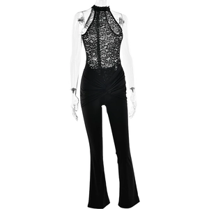 Detail of lace halter jumpsuit featuring sheer bodice and waist twist design