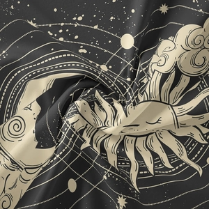 Close-up of bohemian sun and moon tapestry fabric showing celestial print and soft texture