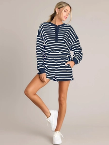 Detail of navy and white striped long sleeve top and elastic shorts lounge set