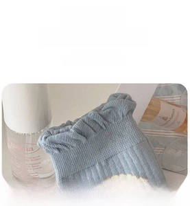 Detail view of high elastic ribbed cuffs on light blue knit cotton socks for women