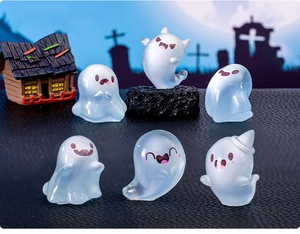 Macro detail of six luminous Halloween ghost figurines on a dark textured surface