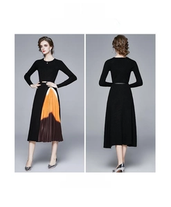 Détail d'une robe en maille ajustée avec ourlet plissé asymétrique à effet dégradé chic