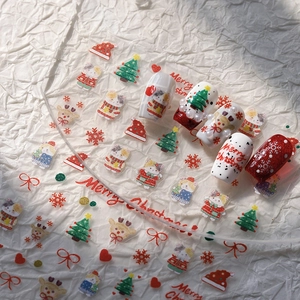 5D embossed Christmas nail stickers with festive cat, reindeer, and snowflake designs