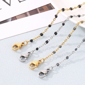 Minimalist stainless steel beaded bracelet set with cross and lobster clasp in gold and silver