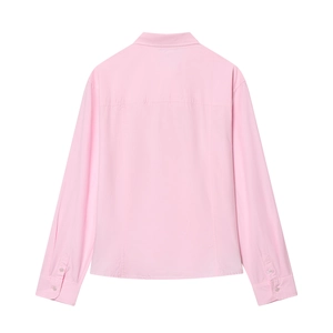 Minimalist pink poplin long sleeve shirt with back yoke seam detail on white background
