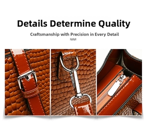Detail view of brown crocodile texture handbag showing silver buckles and metal hardware