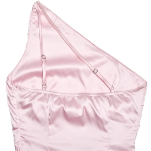 Detail of pink satin dress back with adjustable thin straps and glossy asymmetric design