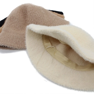 Faux mink fur bucket hat for women in beige and camel showing interior adjustable strap