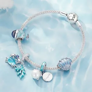 S925 sterling silver ocean charm bracelet with blue enamel crab and shell pendants