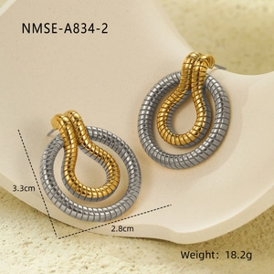 Detailed view of two-tone twisted stripe earrings with 18K gold and silver finish