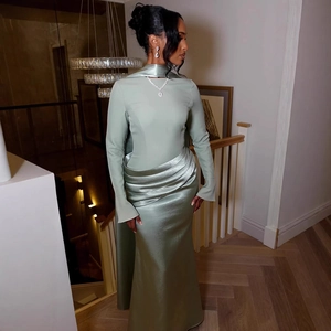 Elegant light green satin long sleeve maxi dress with high neck and waist pleats