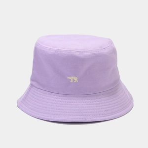 Close-up of lavender bucket hat featuring white polar bear embroidery and stitched brim