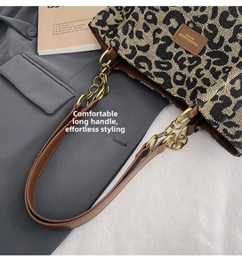 Leopard print tote bag with brown leather straps and gold chain links detail