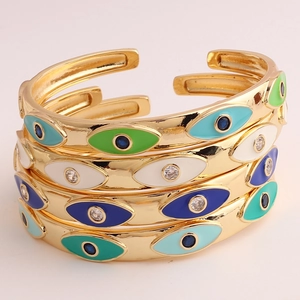 Adjustable gold plated enamel evil eye cuff bracelets set with crystal accents