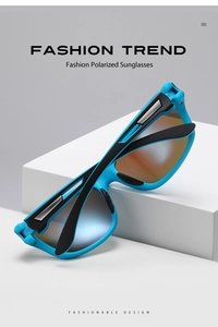 Detail of blue polarized sports sunglasses with gold-orange mirror lenses on stone blocks