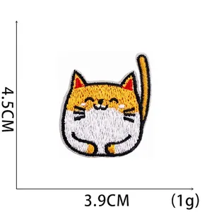 Detailed embroidery of a yellow cartoon cat patch showing 4.5cm by 3.9cm dimensions