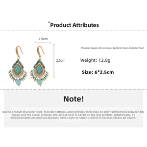 Detail view of vintage flower drop earrings with turquoise stones and faux pearls