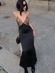 Elegant black lace patchwork slip dress with satin fishtail hem and pleated detail