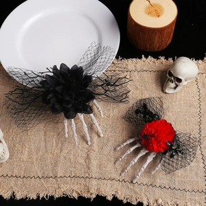 Halloween skull hand hair clips with red and black roses and mesh veil on wooden background