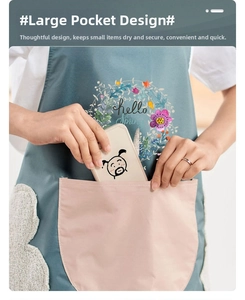 Detail of waterproof apron with large pink pocket and phone storage for kitchen use