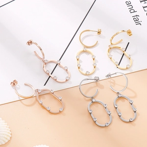 Boucles d'oreilles ovales doubles en or rose, or et argent avec zircons brillants