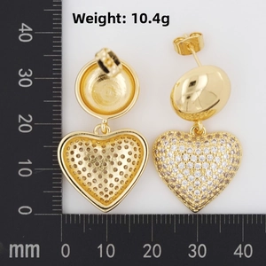 Detailed size and 10.4g weight measurement of gold heart earrings with pave stones