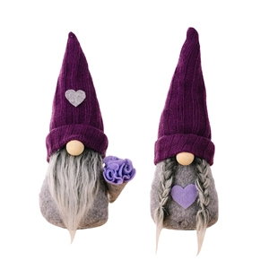 Plush Christmas gnomes in purple knit hats with long gray beard and braids on white background