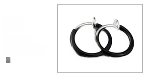 Detail of black stainless steel clip-on earrings with silver spring mechanism for men