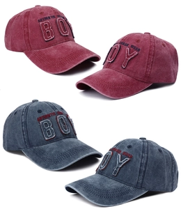 Detail showing vintage washed cotton fabric and BOY embroidered patches on baseball caps