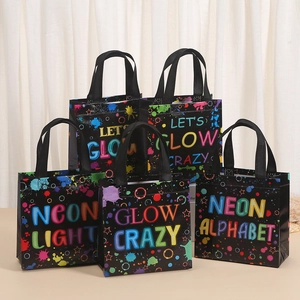 Detail showing high-quality black non-woven gift bags with vibrant neon LET'S GLOW CRAZY print