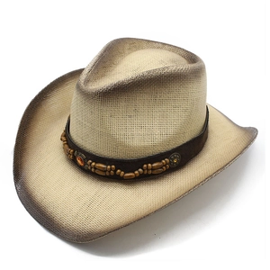 Detail of woven straw cowboy hat with brown spray-paint finish and beaded band