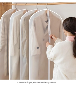 Close-up of translucent PEVA garment bag with smooth zipper for closet storage