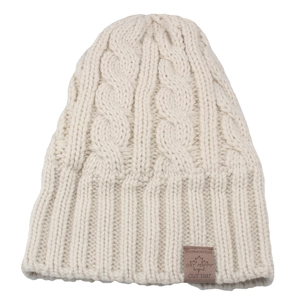 Thick cable knit beanie in cream white with cozy fleece lining and leather patch detail