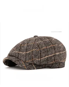 Detail of grey herringbone newsboy cap fabric texture and fine stitching for men