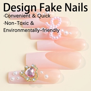 French tip press-on nails with 3D pink bows, pearls, and heart gem in XXL length