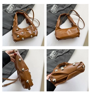 Detail view of caramel brown studded underarm bag showing front, side and bottom angles