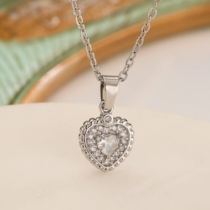 Silver heart pendant necklace with shimmering zircon stones and delicate cable chain