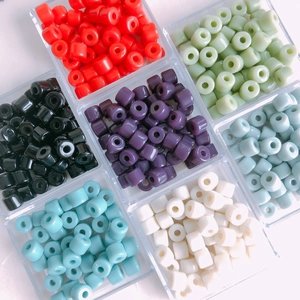 Macro shot of colorful cylindrical acrylic spacer beads with holes for DIY jewelry making