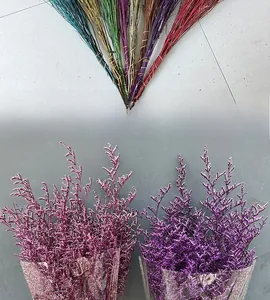 Close-up of colorful dried statice flower bouquets in blue yellow and purple colors