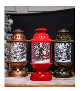 Three vintage Christmas lanterns with snowmen and Santa Claus scenes and warm LED lighting
