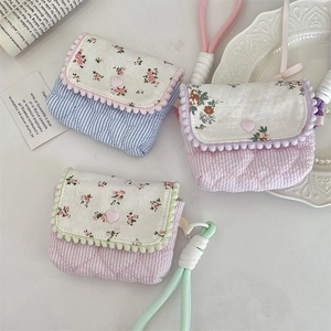 Quilted floral cotton cases for CCD cameras and earphones with heart snap and pom-pom trim