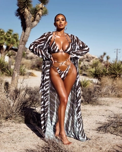 Close-up of zebra print beach cover-up with tie-dye bikini set for summer vacation