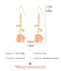 Detail showing dimensions of retro rose drop earrings with pink enamel finish and gold stems